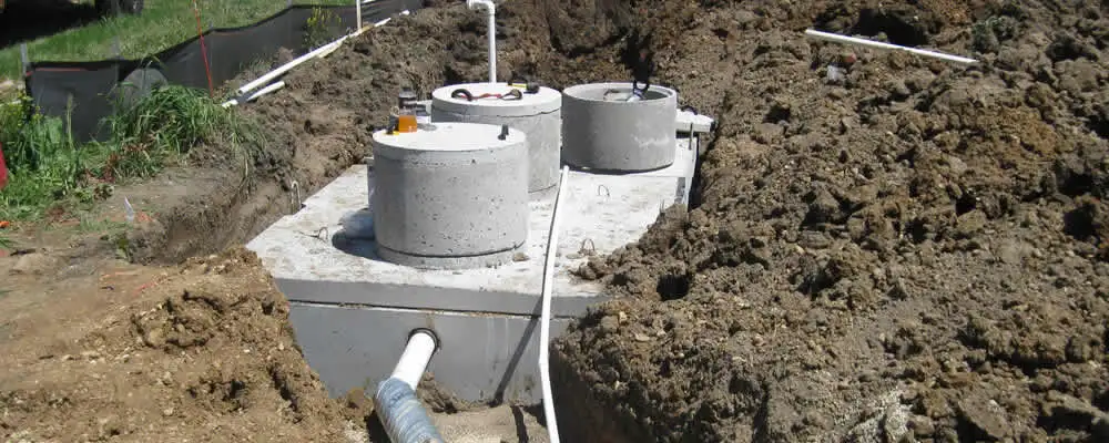 Septic system repair and installation site with tank access ports in Salt Lake City, UT