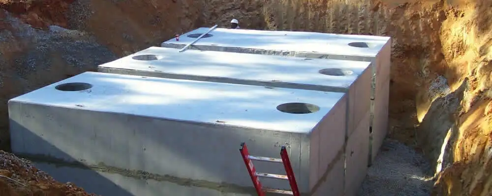 Septic tank installation site with a newly placed concrete tank in Salt Lake City, UT